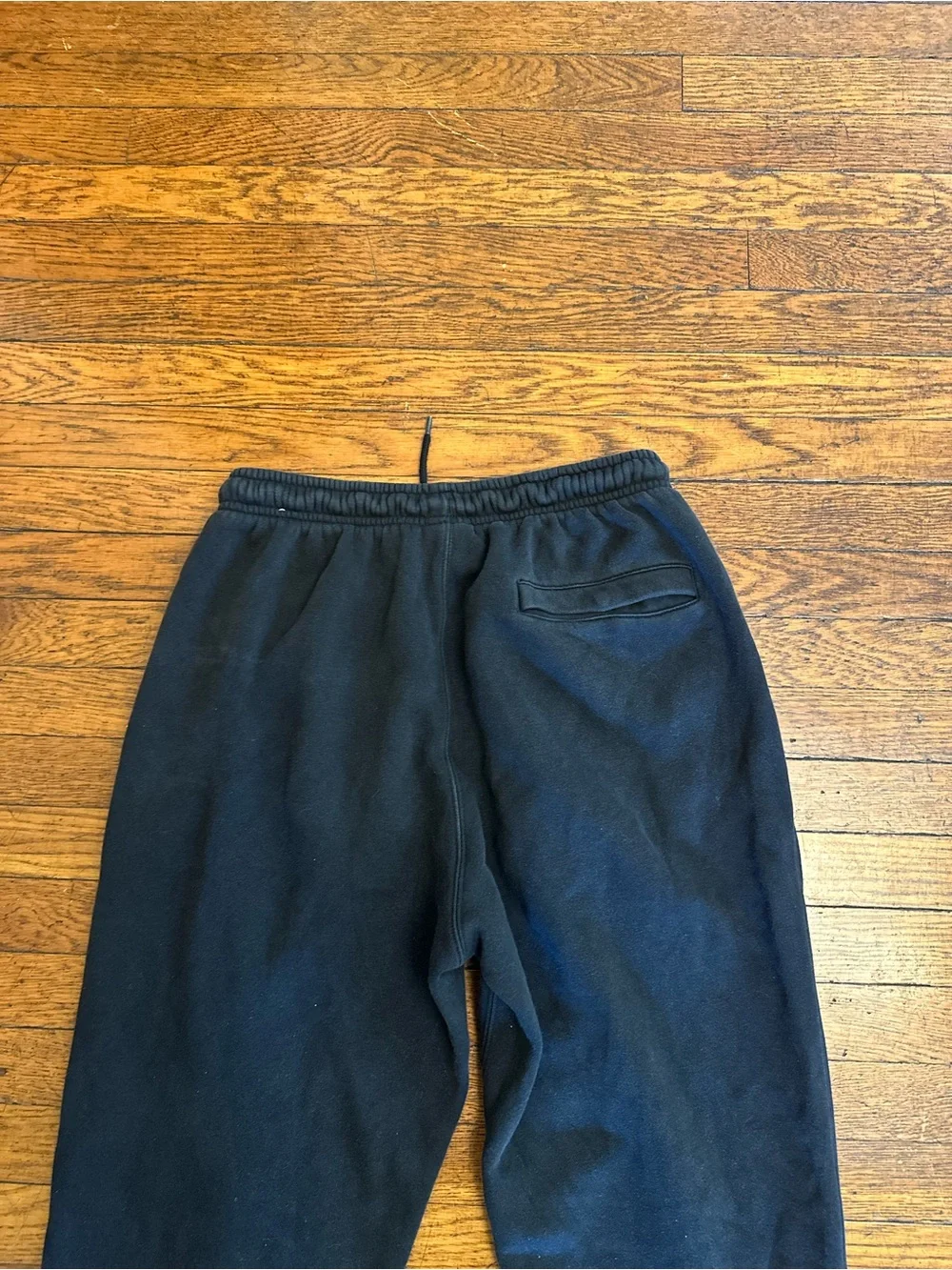 Nike black sweatpants with white logo,